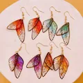 Boucles d'oreilles résine ailes dégradées strass papillon – 1