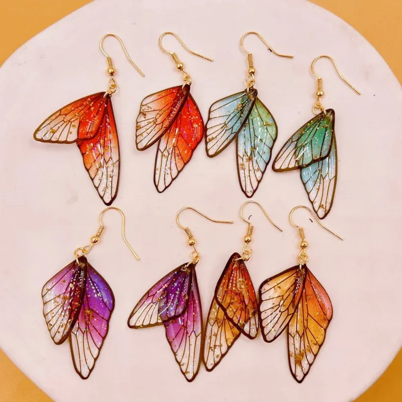 Boucles d'oreilles résine ailes dégradées strass papillon