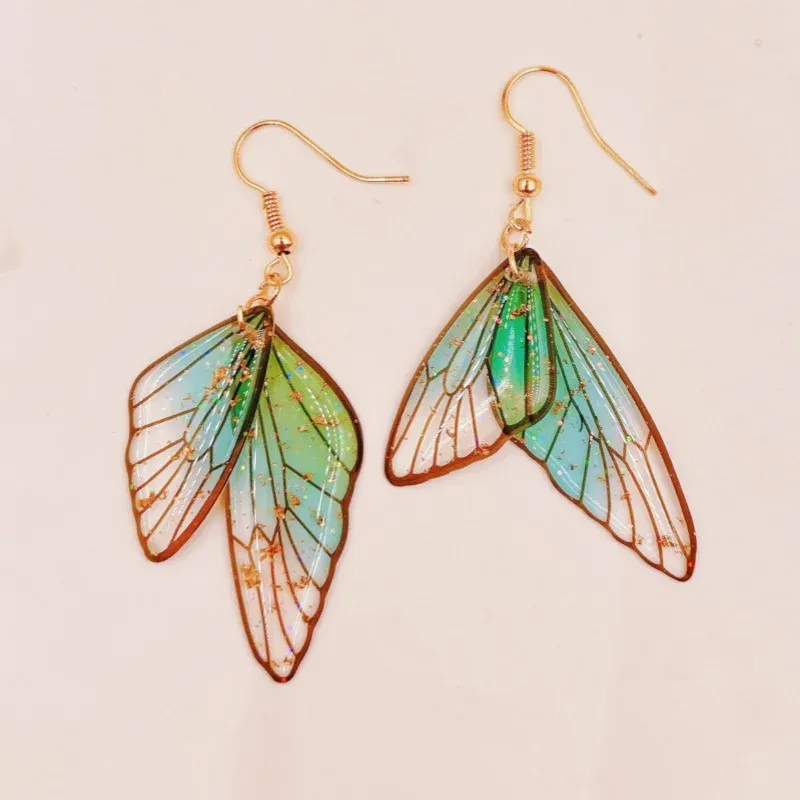Boucles d'oreilles résine ailes dégradées strass papillon