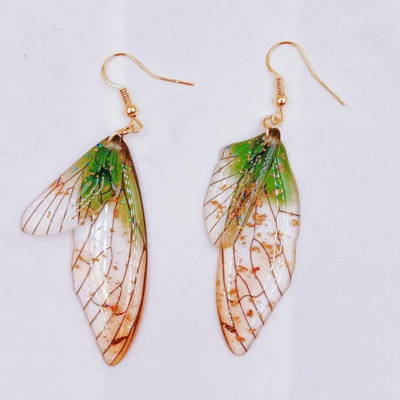 Boucles d'oreilles résine ailes dégradées strass papillon