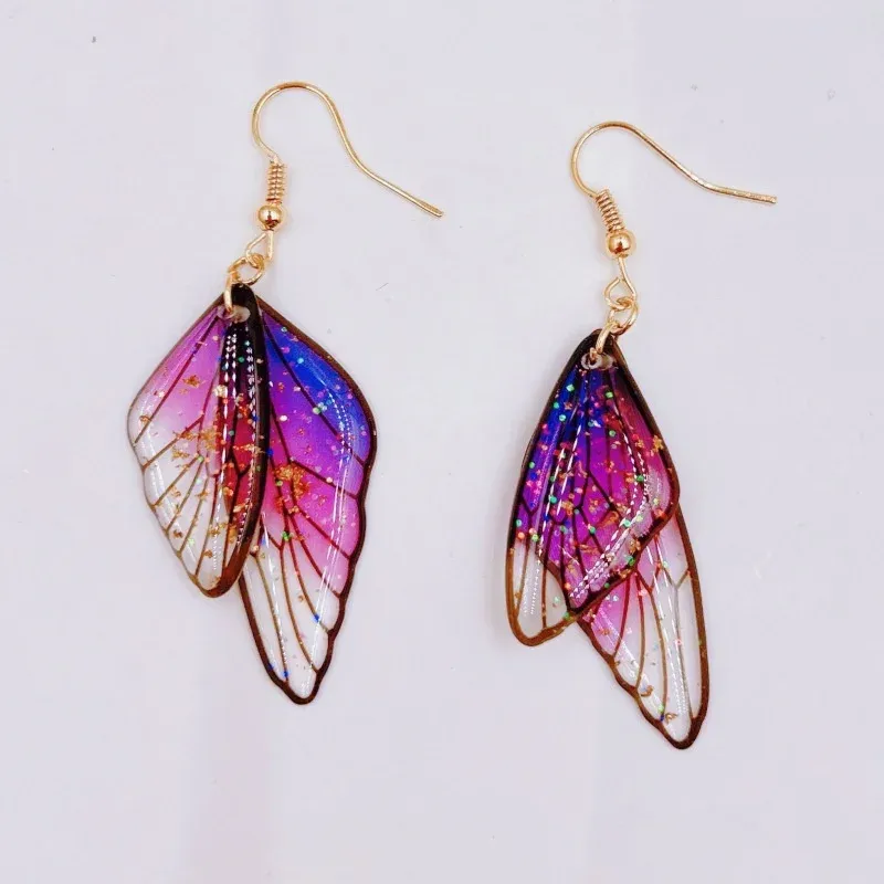 Boucles d'oreilles résine ailes dégradées strass papillon