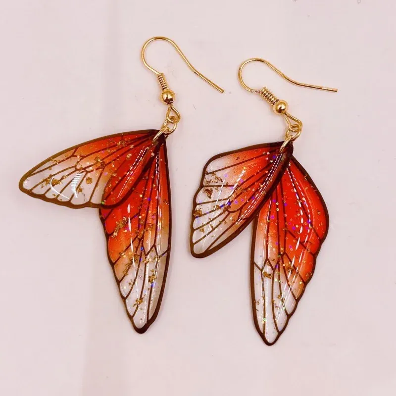 Boucles d'oreilles résine ailes dégradées strass papillon