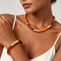 Collier résine ambre marron tube acier inoxydable – 1