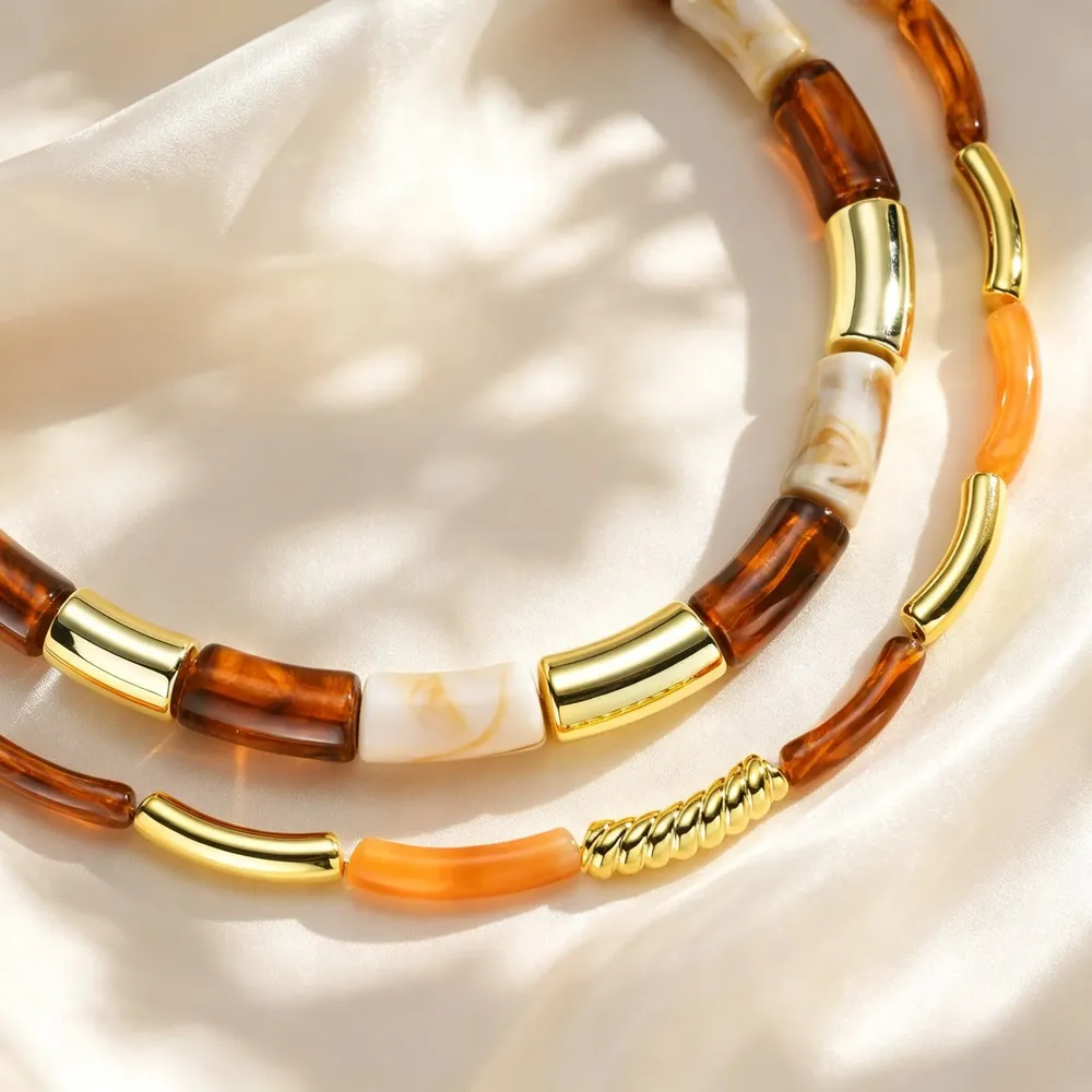 Collier résine ambre marron tube acier inoxydable